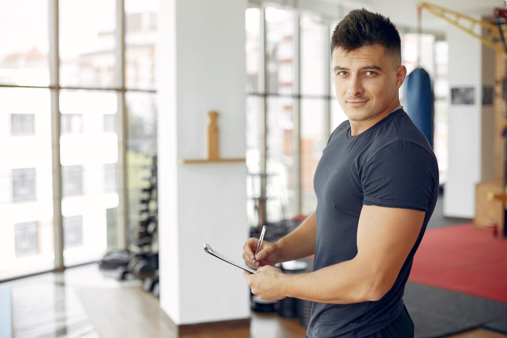 Sports man spend time in a morning gym